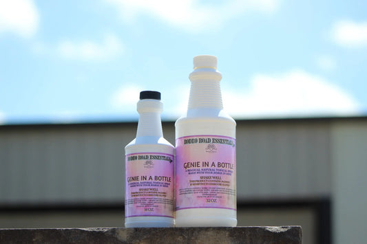 Genie In A Bottle by Rodeo Road Essentials positioned outdoors, highlighting the natural relief properties of this herbal liniment for performance horses.
