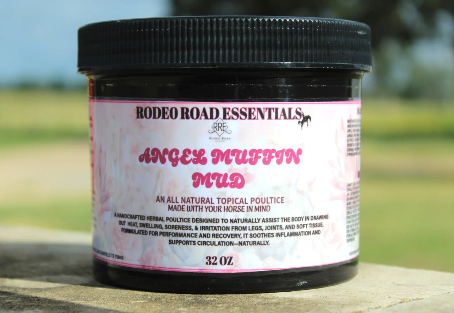 32 oz jar of Angel Muffin Mud displayed outdoors, designed for effective natural healing in horses post-activity.