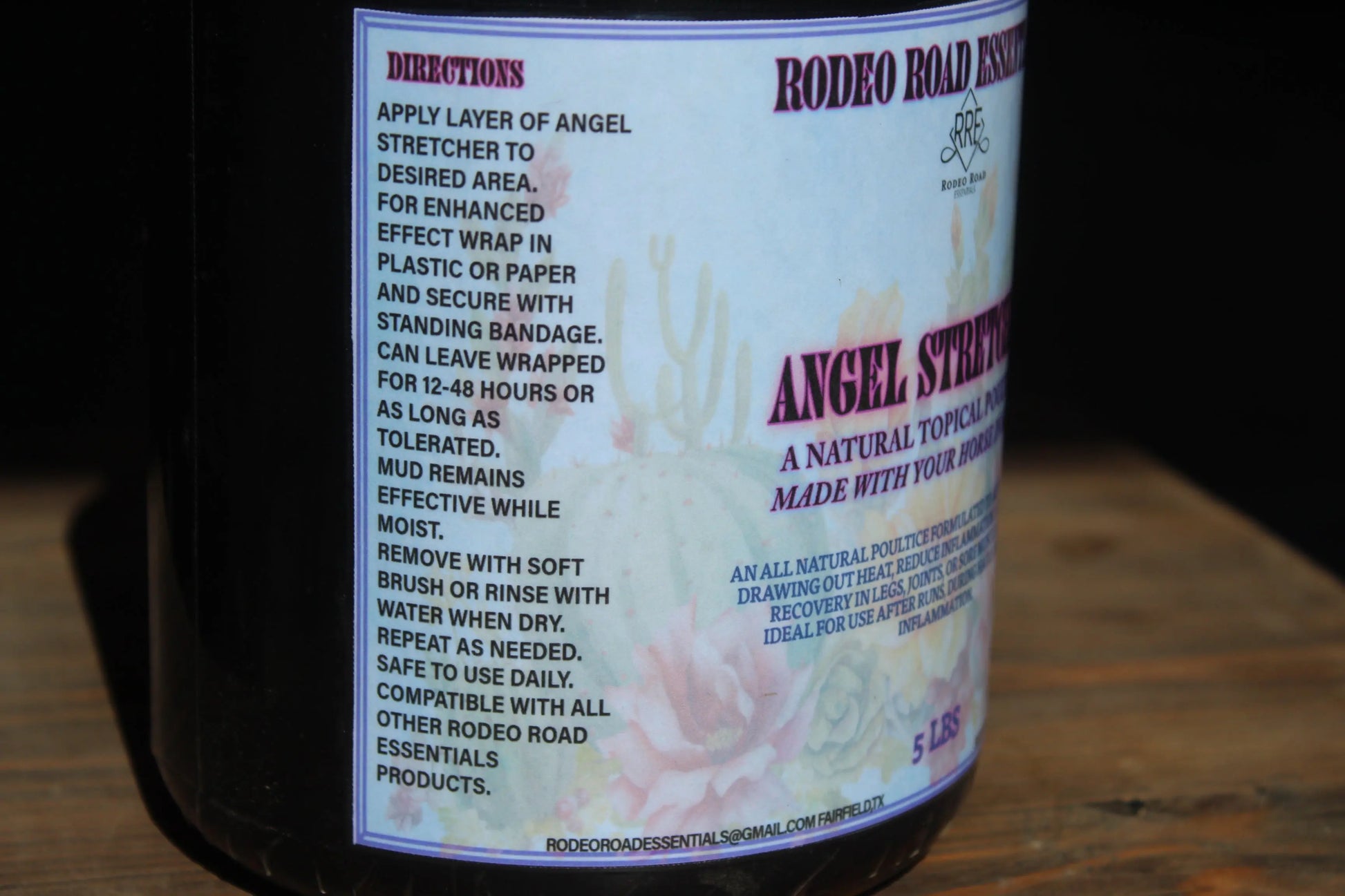 Close-up of the Angel Stretcher by Rodeo Road Essentials, showcasing application instructions on the container for this natural topical poultice made for alleviating horse soreness.